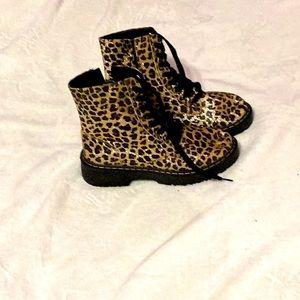 This is a leopard print boot, size 8 with lace.